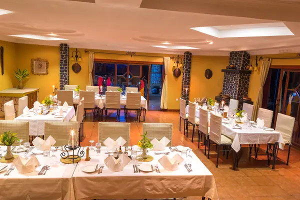 The dining room set for dinner