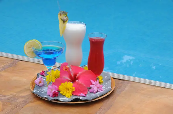 Cocktails on a tray at the poolside