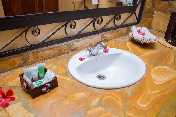 Stone vanity with welcome amenities